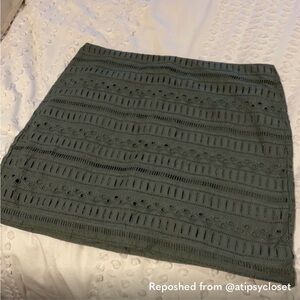 Green eyelet mini skirt